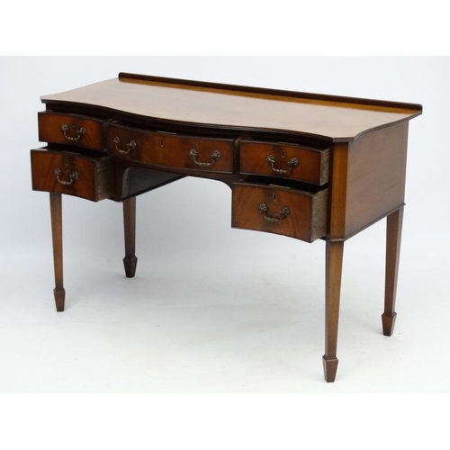 182 - A c.1900 mahogany serpentine shaped writing desk 21 3/4'' deep x 45 1/2'' wide x 30 1/2'' high  Plea... 