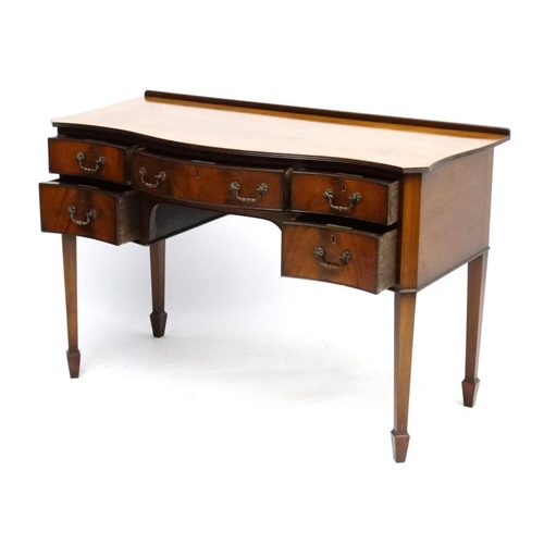 182 - A c.1900 mahogany serpentine shaped writing desk 21 3/4'' deep x 45 1/2'' wide x 30 1/2'' high  Plea... 