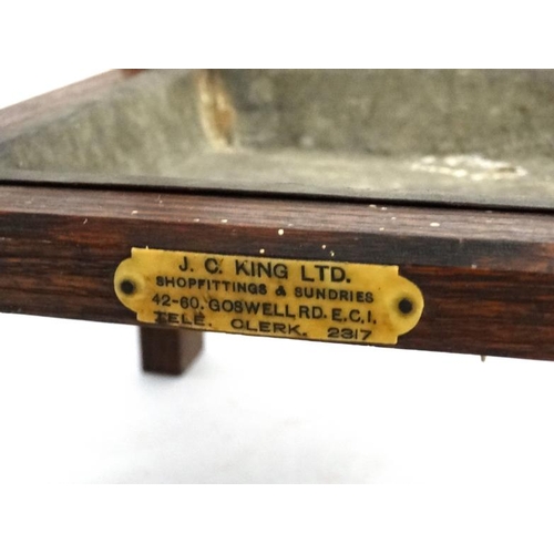 184 - An early 20thC oak four sectional stick / umbrella stand bears ivorine label ' J C King Ltd ...... C... 