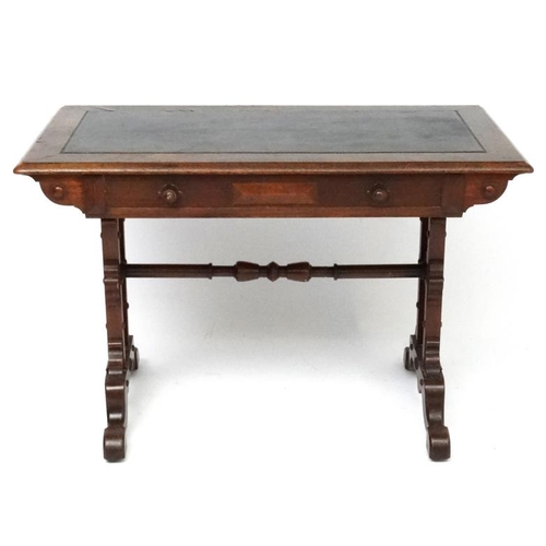 188 - A 19thC Elizabethan Revival oak writing table, with frieze drawer and decorative trestle ends. 42 3/... 