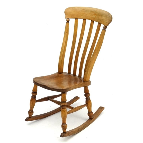 189 - A c.1900 High Wycombe made lathe back elm seated rocking chair 37 1/4'' high  Please Note -  we do n... 