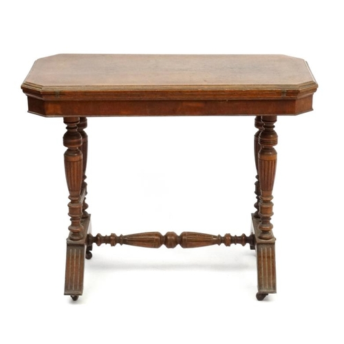 191 - A Victorian stained oak card table with fold over and twist top and gold tooled burgundy leather ins... 