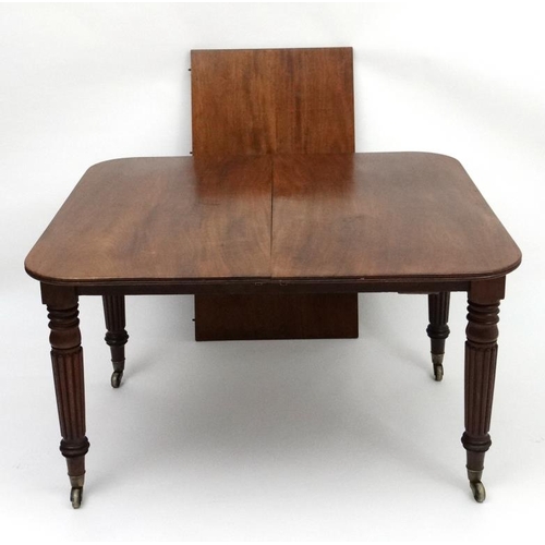 193 - An early 19thC mahogany pull out / drawer out extending dining table by J Cranston in the manner of ... 