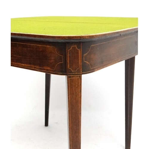 194 - A late 18thC mahogany fold over card table with squared tapering legs and two hinged back legs. 26''... 