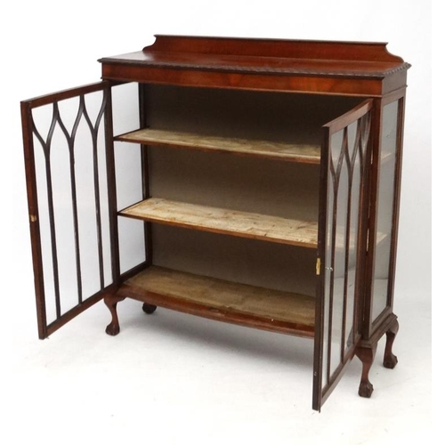 200 - A 1930's walnut bow front display cabinet. 47 1/2'' wide  Please Note -  we do not make reference to... 