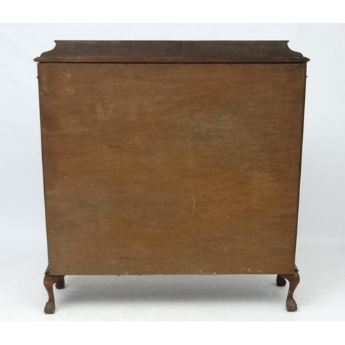 200 - A 1930's walnut bow front display cabinet. 47 1/2'' wide  Please Note -  we do not make reference to... 