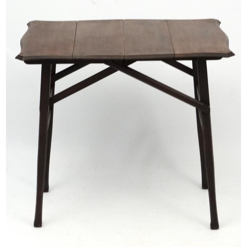 208 - A late 19thC folding  walnut coaching table of serpentine shape 29 1.2'' long x 20'' wide x 27 1/2''... 