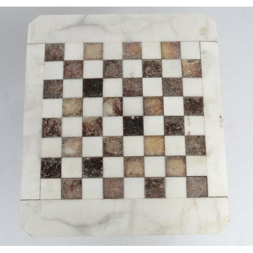 220 - A 20thC onyx engraved marble veined games table with checker board top on pedestal column 23 1/2'' l... 