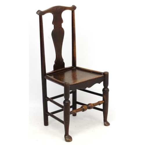 224 - An 18thC oak chair with solid seat and vase shaped splat 37 1/2'' high  Please Note -  we do not mak... 