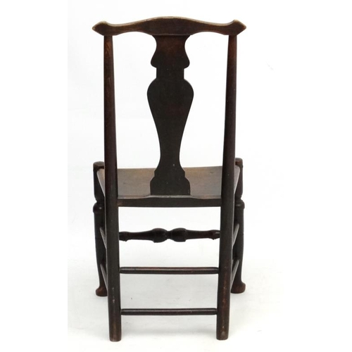 224 - An 18thC oak chair with solid seat and vase shaped splat 37 1/2'' high  Please Note -  we do not mak... 