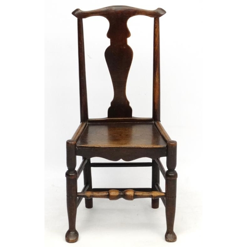 224 - An 18thC oak chair with solid seat and vase shaped splat 37 1/2'' high  Please Note -  we do not mak... 