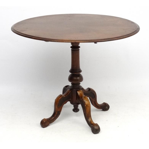 230 - A 19thC oval walnut pedestal occasional table with 4 feet 35 1/2'' long x 29 1/2'' wide x 29'' high ... 