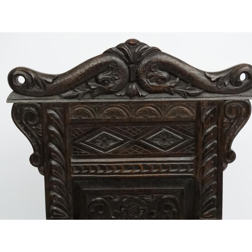 234 - A 19thC carved oak Wainscot chair 49'' high overall.  Please Note -  we do not make reference to the... 