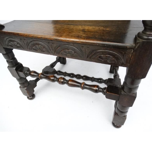 234 - A 19thC carved oak Wainscot chair 49'' high overall.  Please Note -  we do not make reference to the... 