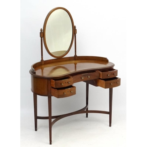 242 - An early - mid 20thC mahogany kidney shaped dressing table and mirror 39 1/2'' wide x 53 1/2'' high ... 