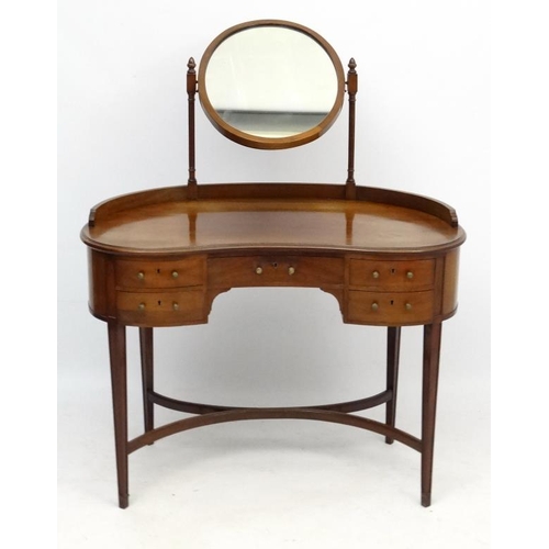 242 - An early - mid 20thC mahogany kidney shaped dressing table and mirror 39 1/2'' wide x 53 1/2'' high ... 