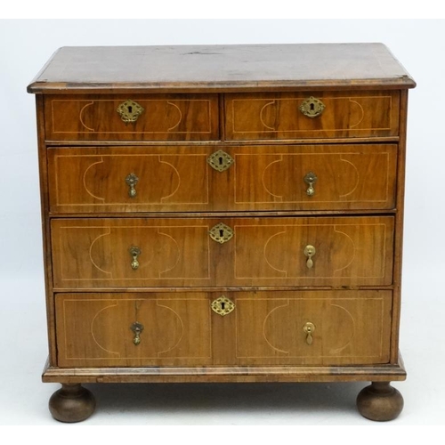 245 - An 18thC Dutch walnut inlaid chest of drawers comprising two short over 3 graduated long drawers wit... 