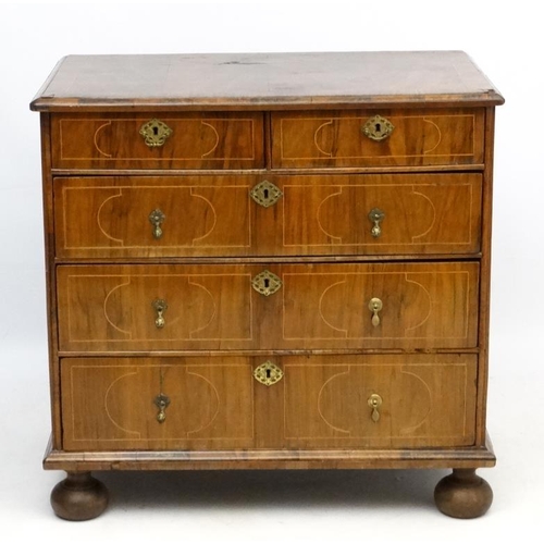 245 - An 18thC Dutch walnut inlaid chest of drawers comprising two short over 3 graduated long drawers wit... 