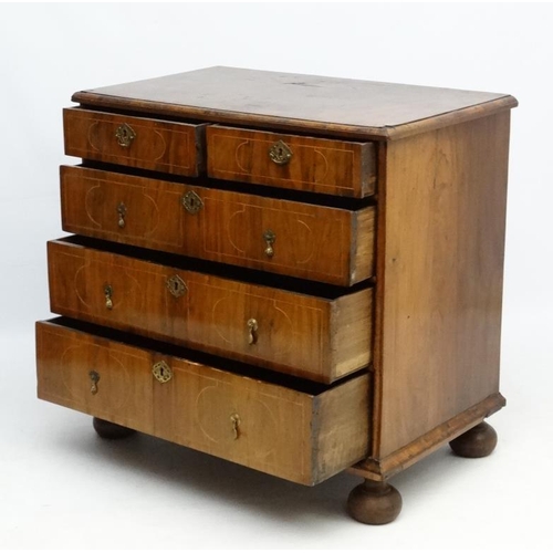 245 - An 18thC Dutch walnut inlaid chest of drawers comprising two short over 3 graduated long drawers wit... 