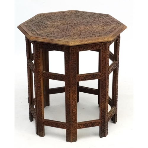 250A - A circa 1900 Indian octagonal carved wood 2 part table , measuring 21'' diameter x 22 1/2'' high. Pl... 