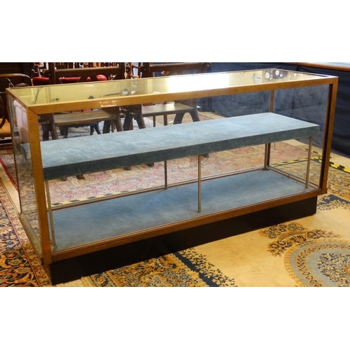 253 - A mid 20thC glazed shop display cabinet of brass and glass 71'' wide x 36'' high x 23'' deep  Please... 