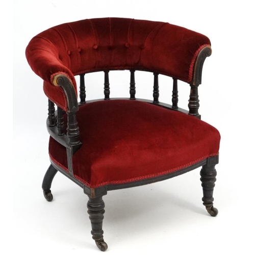 265 - A late Victorian ebonised mahogany Smokers Bow chair with red velvet button back upholstery 28 1/2''... 