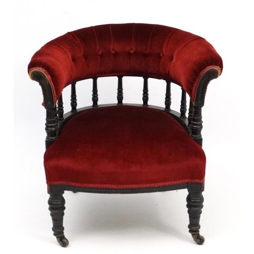 265 - A late Victorian ebonised mahogany Smokers Bow chair with red velvet button back upholstery 28 1/2''... 