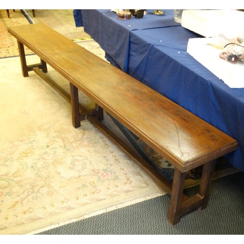 270 - A c.1900 long mahogany bench having chamfered legs and stretcher. 14 1/2'' wide x 20'' high x approx... 