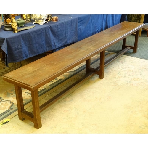 270 - A c.1900 long mahogany bench having chamfered legs and stretcher. 14 1/2'' wide x 20'' high x approx... 