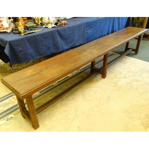 270 - A c.1900 long mahogany bench having chamfered legs and stretcher. 14 1/2'' wide x 20'' high x approx... 