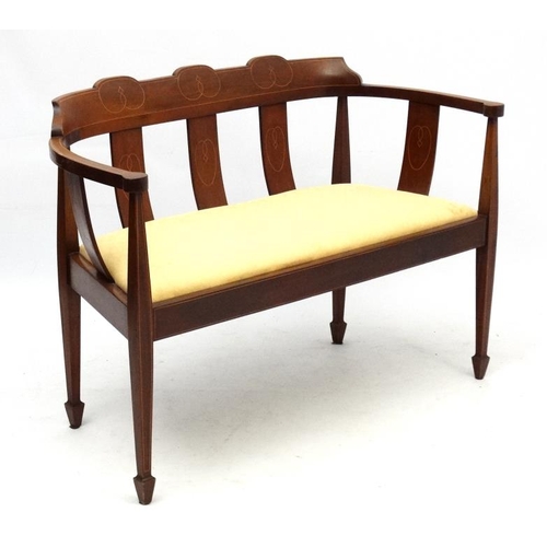 272 - An Edwardian inlaid 2-seat mahogany sofa with stringing and Art Nouveau decoration.  31 1/2'' high x... 