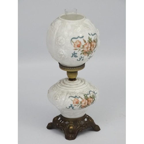 278 - A Victorian style oil lamp with transfer floral style decoration and moulded white glass shade and r... 