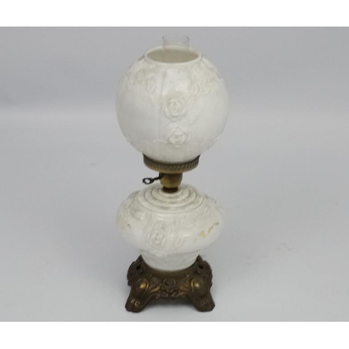 278 - A Victorian style oil lamp with transfer floral style decoration and moulded white glass shade and r... 