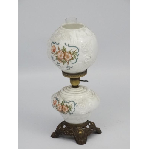 278 - A Victorian style oil lamp with transfer floral style decoration and moulded white glass shade and r... 