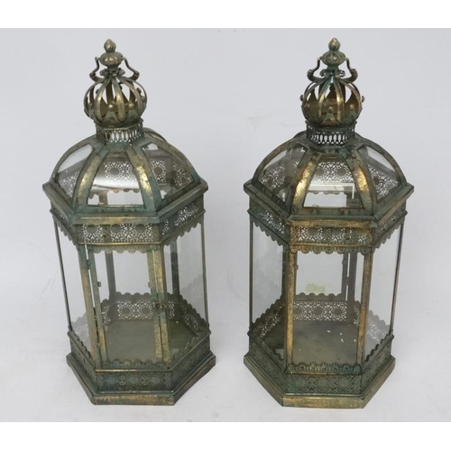 285 - A pair of hexagonal formed lanterns with glass panels approx ( late 20thC / 21stC ) 25'' high.  Plea... 