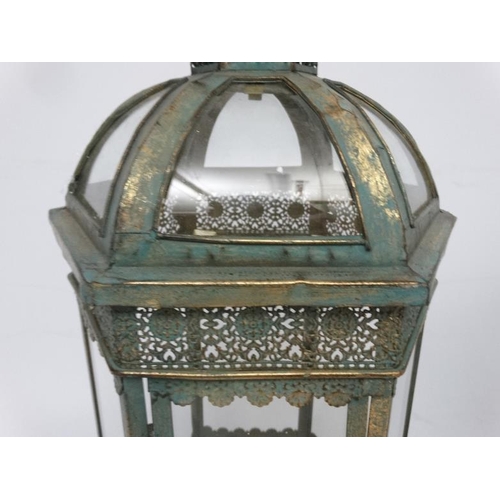 285 - A pair of hexagonal formed lanterns with glass panels approx ( late 20thC / 21stC ) 25'' high.  Plea... 