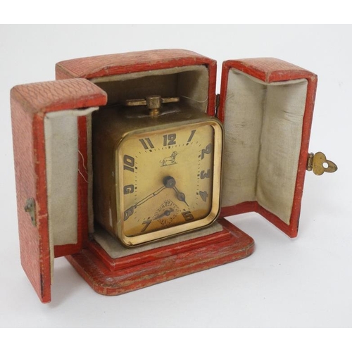 309 - Duverdrey & Bloque Cased alarm clock : an Art Deco square leather cased (and silk lined ) with Arabi... 