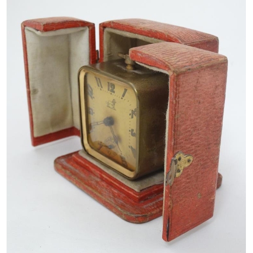 309 - Duverdrey & Bloque Cased alarm clock : an Art Deco square leather cased (and silk lined ) with Arabi... 