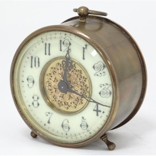 311 - C.1900 brass Bedside Clock : a bevelled glass fronted 3 3/4'' drum movement Timepiece with platform ... 