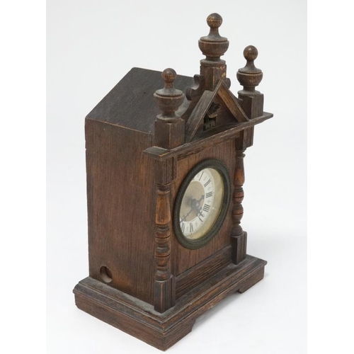 321 - Oak cased Cuckoo mantle Clock : a German made 2 3/4'' dial mantle clock  with two bellows and moving... 