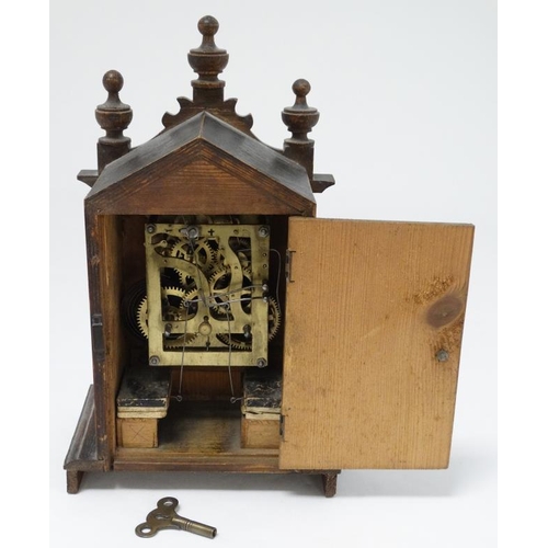 321 - Oak cased Cuckoo mantle Clock : a German made 2 3/4'' dial mantle clock  with two bellows and moving... 