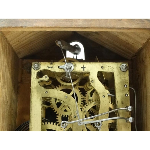 321 - Oak cased Cuckoo mantle Clock : a German made 2 3/4'' dial mantle clock  with two bellows and moving... 