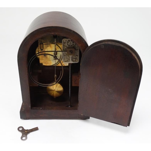 330 - Junghans Arch cased mantle clock : an 8 day plated  pendulum clock , striking on a coiled gong, with... 