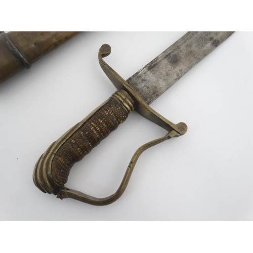 335 - Militaria : An unusual 19thC Eastern Sword , the brass hilt formed in Georgian pattern with bent gua... 