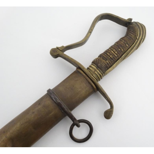 335 - Militaria : An unusual 19thC Eastern Sword , the brass hilt formed in Georgian pattern with bent gua... 