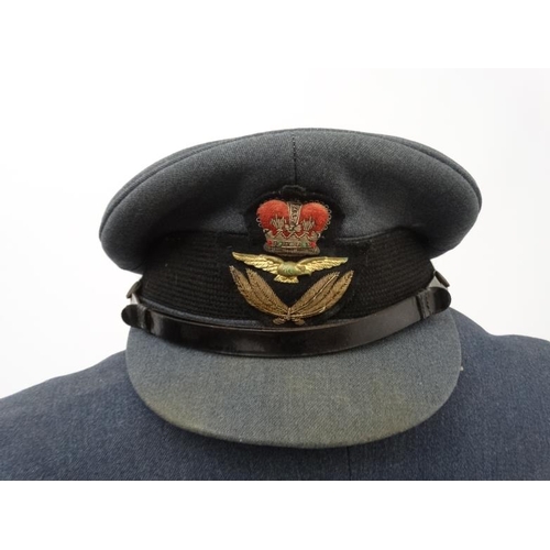 337 - Militaria : A 20thC RAF Squadron Leader's Tunic by Burton , with applied Defence and War Medal ribbo... 