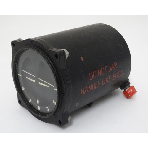 338 - Militaria : A mid 20thC Artificial Horizon Unit , dated 1947 with MOD broad arrow stamp .  6 1/2'' l... 