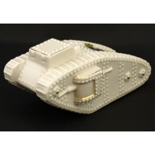 341 - Crestedware: An Arcadian China model of a World War 1 mark IV tank , registered design number 658588... 