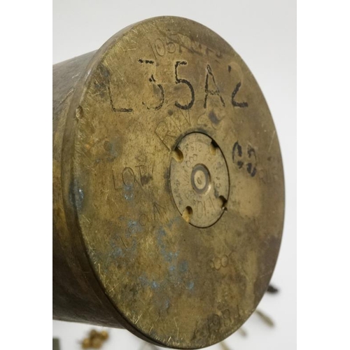 344 - Militaria : A collection of 20thC Military items , comprising a 105mm cannon shell ( inert ) from th... 