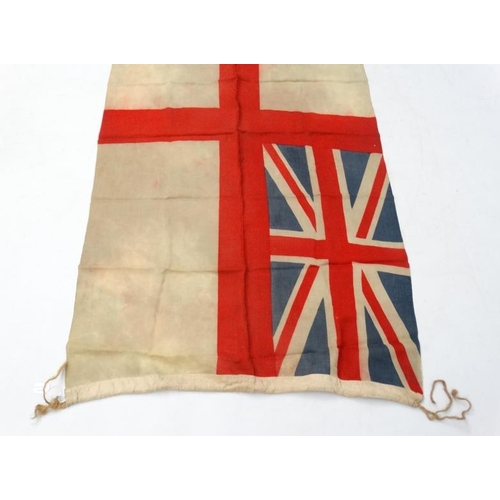 372 - Militaria : A large mid-20thC British Royal Navy White Ensign flag , probably from a WWII vessel , a... 